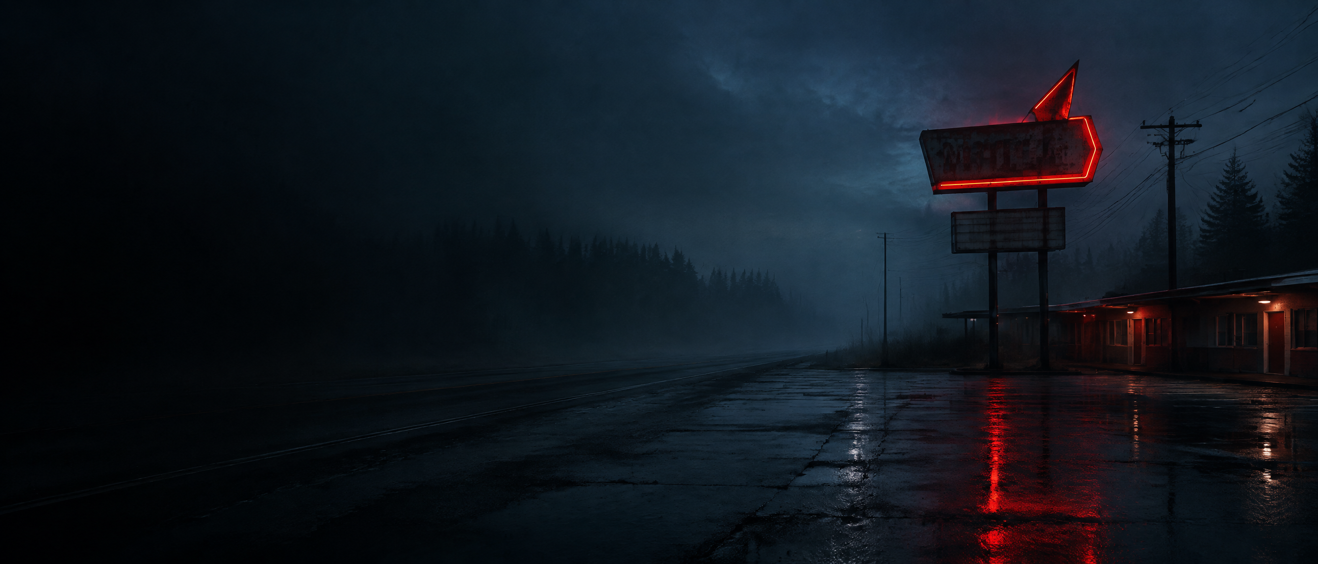 A rain-soaked roadside motel glowing in the dark